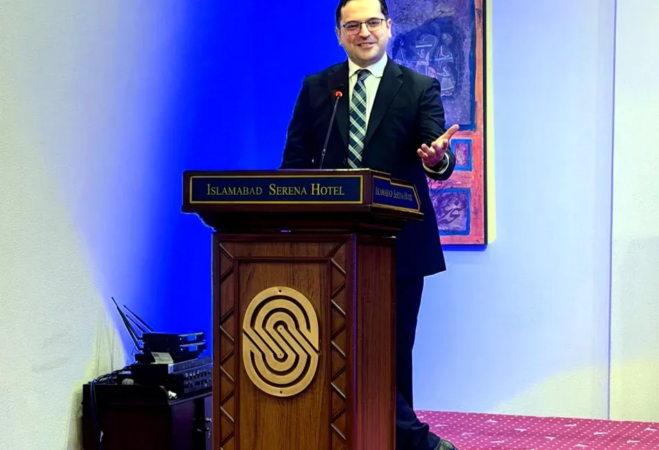 Dr. Maaz Bin Badshah speaking at a conference in Islamabad