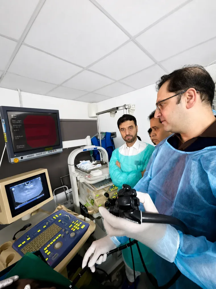 Dr. Maaz Bin Badshah performing endoscopic ultrasound (EUS) at Shifa International Hospital, with trainees observing the scan