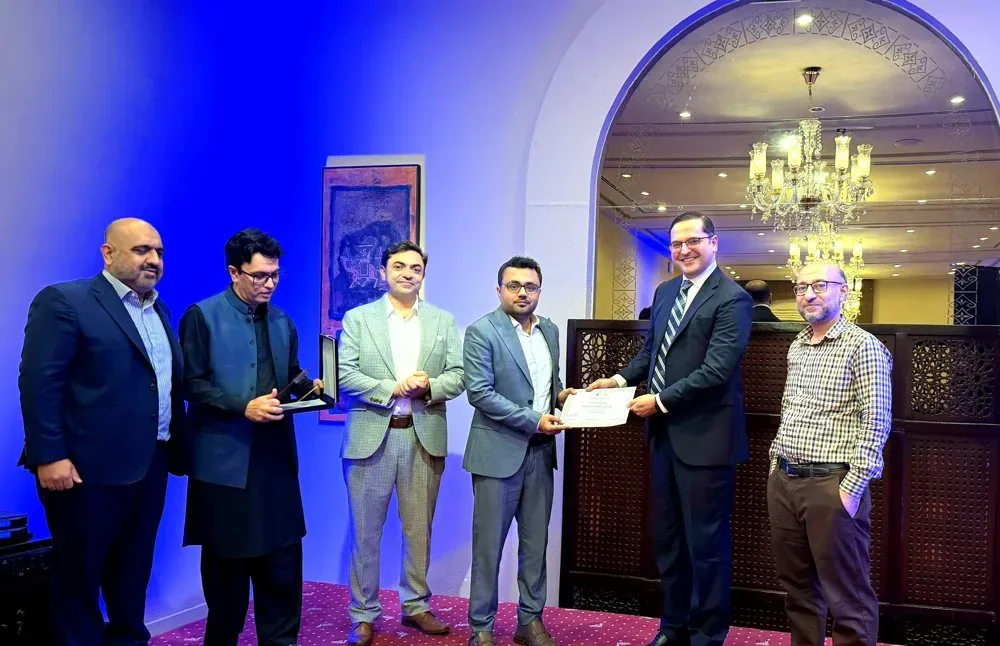 Dr. Maaz Bin Badshah presenting certificates as Program Director